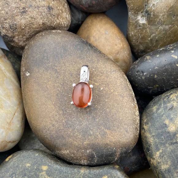 Baltic Amber and White Topaz pendant set in 925 Sterling Silver